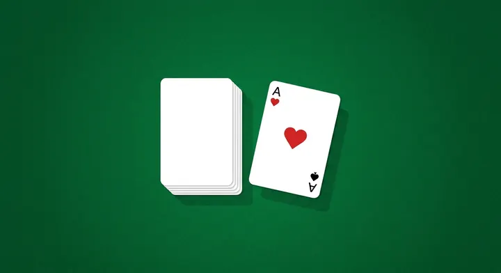 A face-down reserve pile with its top card turned face up beside it in Canfield Solitaire